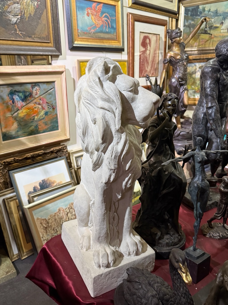 Marble Torso amid Gallery Sculptures